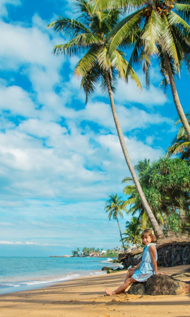 Child girl on the beach in Sri Lanka. Selective focus.