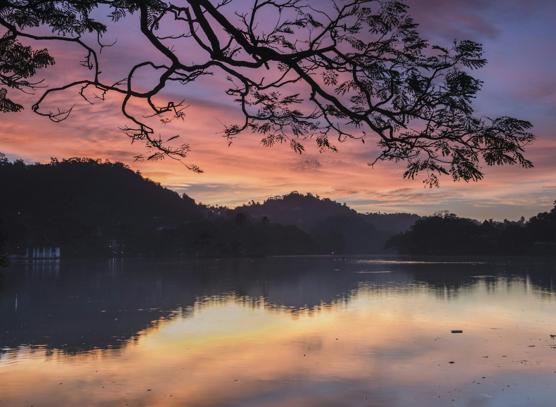 Dramatic sunrise at Kandy Lake and the Clouds Wall (Walakulu Wall), Kandy, Central Province, Sri Lan